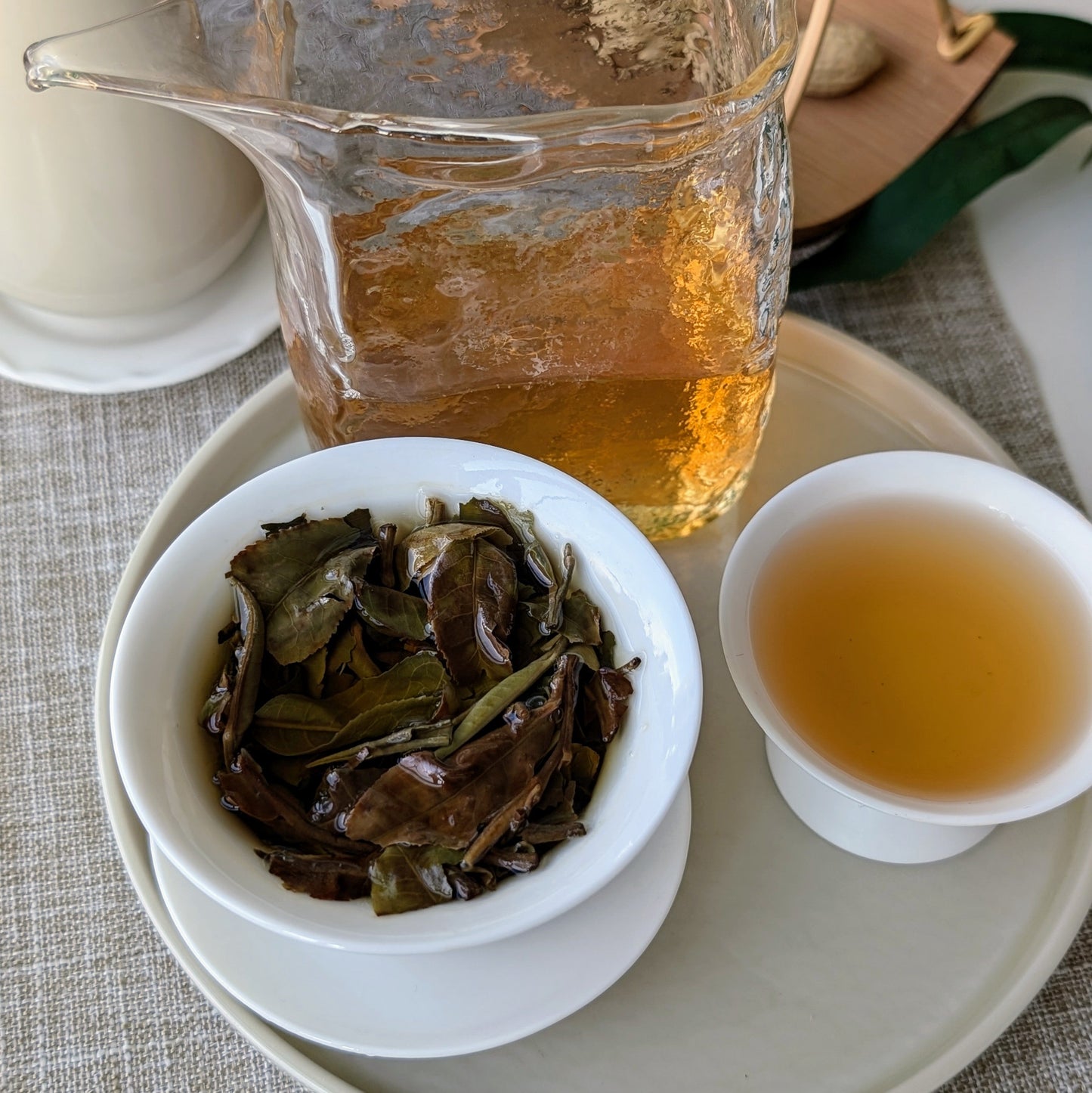 Shou Mei tea leaves and amber liquor