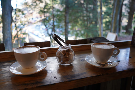 a table with cups and saucers